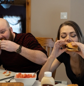 people eating donair burgers